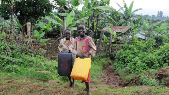 Jacynth and Ruth on their way to fetch water