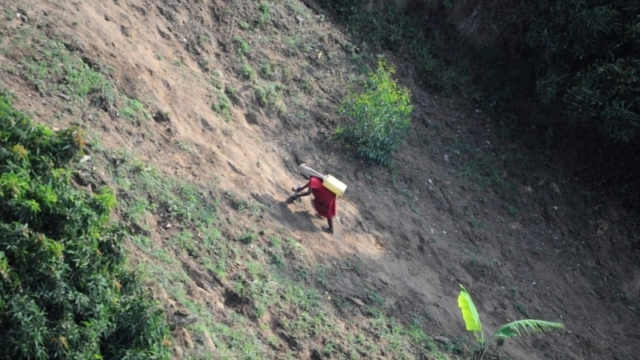 littel girl fetching water, Lake Kivu